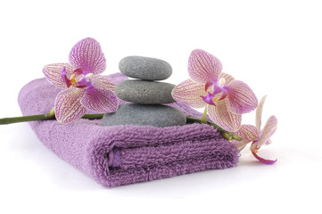 spa concept with pink orchid ,towel and stacked of stones
