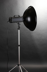 Studio flash on grey background