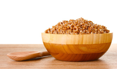 Boiled buckwheat in a wooden bowl