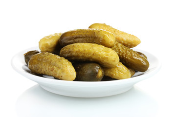Marinated cucumbers on the plate isolated on white