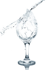 Fototapeta na wymiar Pouring water into glass