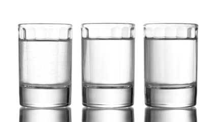 Three glass of vodka isolated on white
