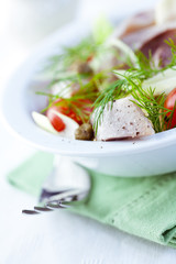 Herring salad with cherry tomato and capers