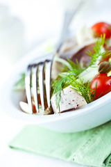Herring salad with cherry tomato and capers