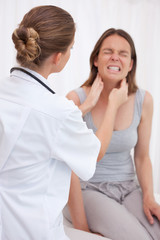 Doctor examining patients jaw