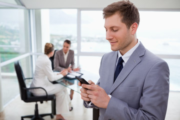 Sales manager writing text message