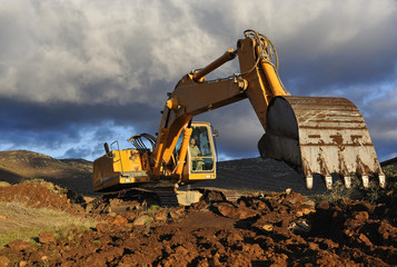 Excavator working on a mountain - 37464698