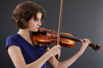 Young female playing the violin