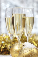 Champagne glass with Christmas ball (shallow dof)