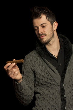 Man Looking At A Cigar