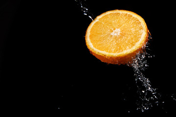 Fototapeta na wymiar fresh water splash and orange