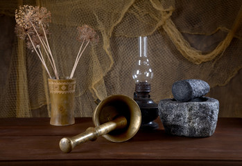 Obraz na płótnie Canvas Still-life with mortars and an oil lamp