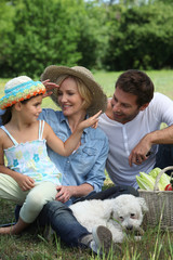 Family outdoors with their dog