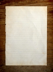 Old paper on wooden background