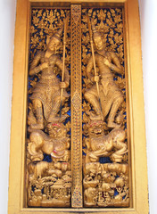 Thai molding art on door of the temple