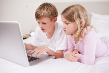 Cute children using a laptop