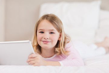 Cute little girl using a tablet computer