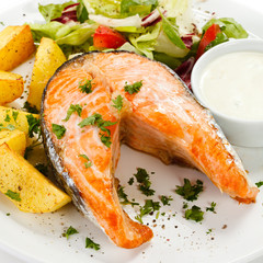 Grilled salmon, baked potatoes and vegetables