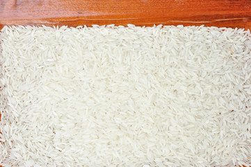 closeup of rice with wooden border