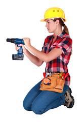 Woman with a cordless drill