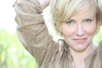 mature woman relaxing in the park