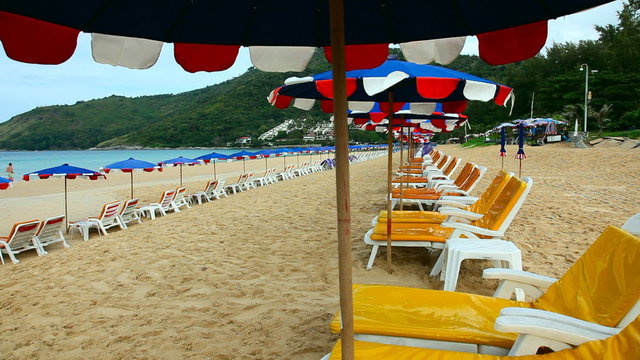 Sandy beach with Loungers and Umbrellas.