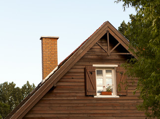 Decorative wooden houses blue sky.