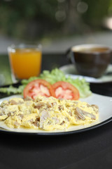 Omelette with mushroom and bacon , orange juice and coffee for b