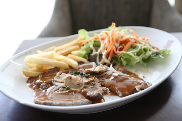 grilled t-bone steak and vegetables