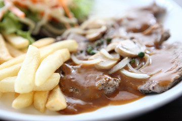 grilled t-bone steak and vegetables