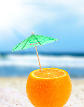 Orange cocktail on a beach