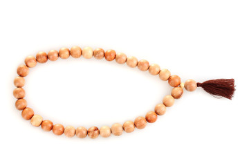 Obraz premium Wooden rosary isolated on white