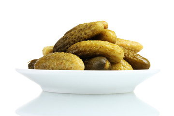 Marinated cucumbers on the plate isolated on white