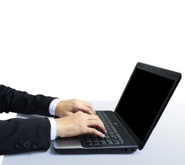 male hands typing on laptop keyboard
