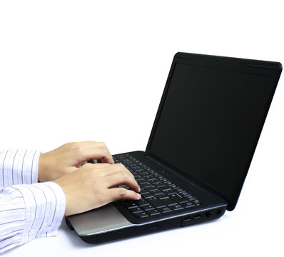 male hands typing on laptop keyboard