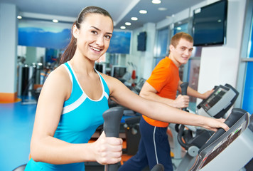 Happy woman with at training gym