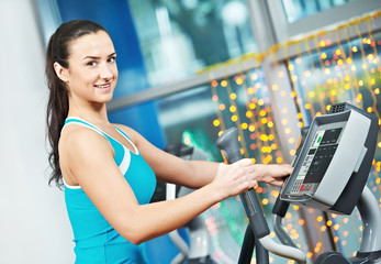 Happy woman with at training gym