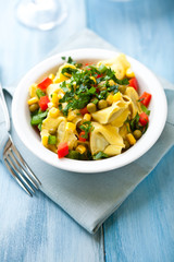 Tortellini with vegetables and fresh parsley