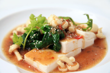 Chinese tofu with xo sauce and mushroom on white background