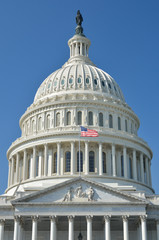 US Capitol building detail with US flag - Washington DC