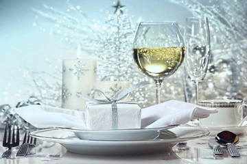 Festive  dinner setting with gift for the holidays