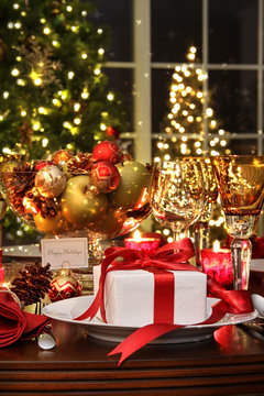 Festive table setting with red ribbon gift