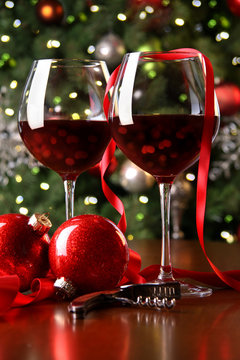 Holiday background with glasses of red wine