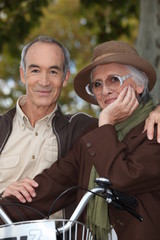 Elderly couple with bicycle