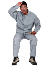 Naklejka premium Shocked laborer, studio shot