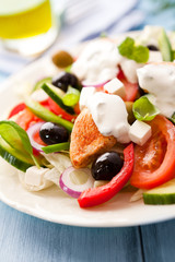 Mediterranean-style chicken salad with tzatziki sauce