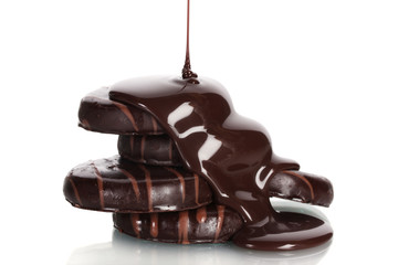 Сhocolate cookies poured chocolate isolated on white