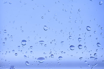 Fototapeta na wymiar Water drops blue background