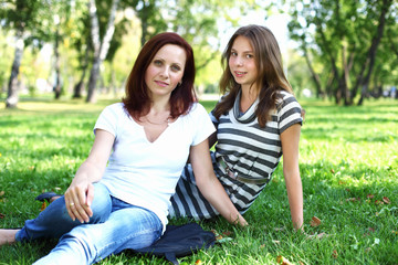 Naklejka premium Mother with her daughter in summer park