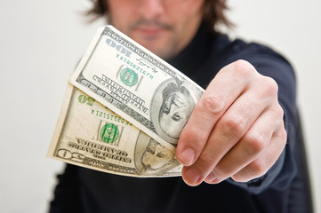 Man paying in dollars